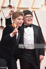 HOLLYWOOD, CALIFORNIA - FEBRUARY 09: (L-R) Roman Griffin Davis and Archie Yates attend the 92nd Annual Academy Awards at Hollywood and Highland on February 09, 2020 in Hollywood, California. (Photo by Jeff Kravitz/FilmMagic)